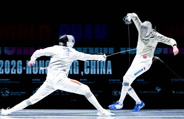 CHINA, HONG KONG - JULY 27, 2026: Romania s Radu Nitu (L) and Russia s Pavel Graudyn compete in the men s individual sabre event at the 2026 Kerry Fencing World Championships. Mikhail Sinitsyn TASS  95535696