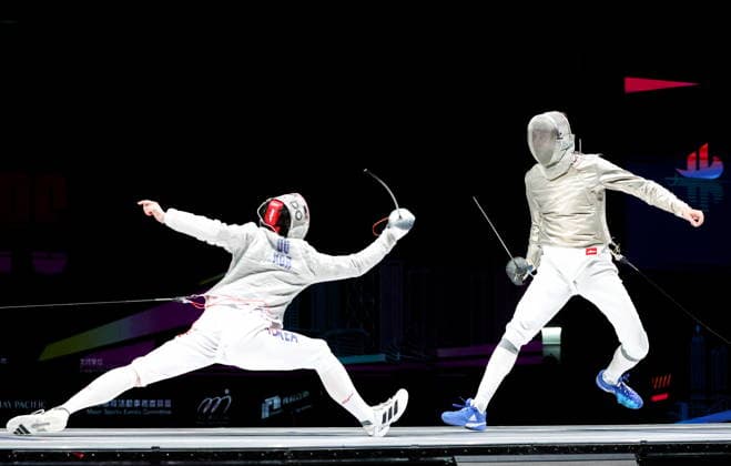 CHINA, HONG KONG - JULY 27, 2026: South Korea s Gyeong-dong Do (L) and Russia s Pavel Graudyn compete in a men s individual sabre event at the 2026 Kerry Fencing World Championships. Mikhail Sinitsyn TASS  95536212