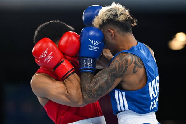 COM26 BOXING, Marion Ah Tong of Samoa (red) fights Tavita Kaoma of Kiribati during the Men™s 70kg Round of 16 match of the Glasgow 2026 Commonwealth Games at SEC Centre in Glasgow, Scotland, Monday, July 27, 2026. ( NO ARCHIVING, EDITORIAL USE ONLY Glasgow Scotland United Kingdom  Copyright: xLUKASxCOCHx 20260728114111472062