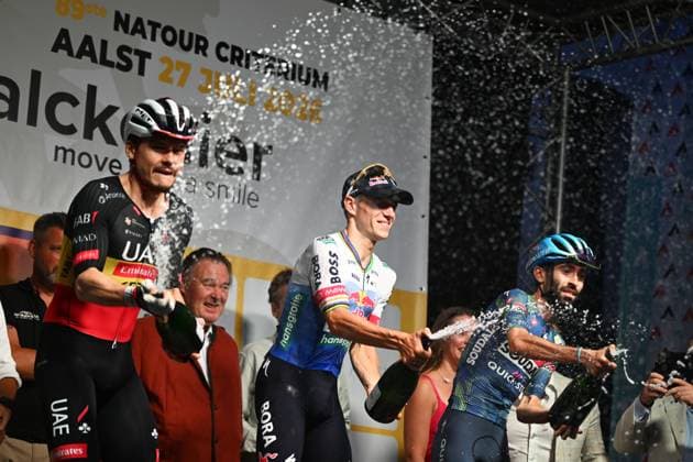 Belgian Rune Herregodts of UAE Team Emirates-XRG; Belgian Remco Evenepoel of Red Bull-BORA-hansgrohe and French Valentin Paret-Peintre of Soudal Quick-Step celebrate on the podium after the Natourcriterium Aalst cycling event, Monday 27 July 2026, in Aalst. The traditional criteriums are local showcases for which mainly cyclists who rode the Tour de France are invited. ELIASxROM  x182186403x