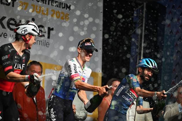 Belgian Rune Herregodts of UAE Team Emirates-XRG; Belgian Remco Evenepoel of Red Bull-BORA-hansgrohe and French Valentin Paret-Peintre of Soudal Quick-Step celebrate on the podium after the Natourcriterium Aalst cycling event, Monday 27 July 2026, in Aalst. The traditional criteriums are local showcases for which mainly cyclists who rode the Tour de France are invited. ELIASxROM  x182186404x
