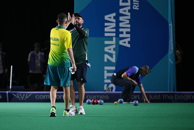 COM26 BOWLS, Aaron Wilson of Australia competes in his bronze medal lawn bowls match at the Glasgow 2026 Commonwealth Games at SEC Centre Hall 3 in Glasgow, Scotland, Tuesday, July 28, 2026. ( NO ARCHIVING, EDITORIAL USE ONLY Glasgow Scotland United Kingdom  Copyright: xDEANxLEWINSx 20260728165359858057