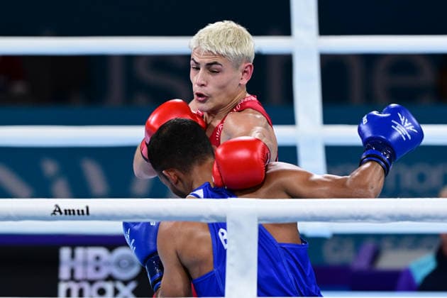 COM26 BOXING, Jye Dixon (red) of Australia in action during his Quarter Final match against Md Rakib Hossain (blue) of Bangladesh during the Glasgow 2026 Commonwealth Games at SEC Centre in Glasgow, United Kingdom, Tuesday, July 28, 2026. ( NO ARCHIVING, EDITORIAL USE ONLY, AUSTRALIA ONLY Glasgow Scotland United Kingdom  Copyright: xDEANxLEWEINSx 20260728118322192577