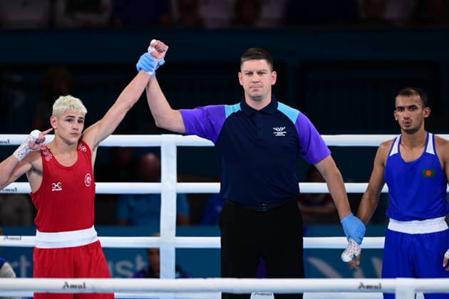 COM26 BOXING, Jye Dixon (red) of Australia celebrates his Quarter Final win against Md Rakib Hossain (blue) of Bangladesh during the Glasgow 2026 Commonwealth Games at SEC Centre in Glasgow, United Kingdom, Tuesday, July 28, 2026. ( NO ARCHIVING, EDITORIAL USE ONLY, AUSTRALIA ONLY Glasgow Scotland United Kingdom  Copyright: xDEANxLEWEINSx 20260728162866307594