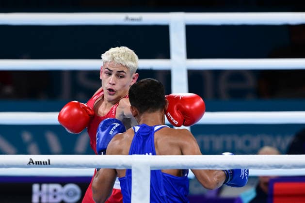 COM26 BOXING, Jye Dixon (red) of Australia in action during his Quarter Final match against Md Rakib Hossain (blue) of Bangladesh during the Glasgow 2026 Commonwealth Games at SEC Centre in Glasgow, United Kingdom, Tuesday, July 28, 2026. ( NO ARCHIVING, EDITORIAL USE ONLY, AUSTRALIA ONLY Glasgow Scotland United Kingdom  Copyright: xDEANxLEWEINSx 20260728133739883183
