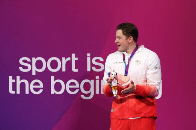 July 27, 2026, Glasgow, Scotland, Great Britain: ADAM RAMSAY-PEATY of England poses with the bronze medal during the Swimming Men s 50m Breaststroke Medal Ceremony of the Commonwealth Games Glasgow 2026 at the Tollcross International Swimming Centre in Glasgow, Scotland. Commowealth Games 2026: Swimming  - ZUMAc179 20260727_zep_c179_502 Copyright: xMickaelxChavetx