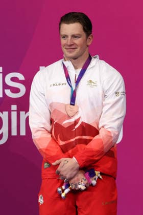 July 27, 2026, Glasgow, Scotland, Great Britain: ADAM RAMSAY-PEATY of England poses with the bronze medal during the Swimming Men s 50m Breaststroke Medal Ceremony of the Commonwealth Games Glasgow 2026 at the Tollcross International Swimming Centre in Glasgow, Scotland. Commowealth Games 2026: Swimming  - ZUMAc179 20260727_zep_c179_504 Copyright: xMickaelxChavetx