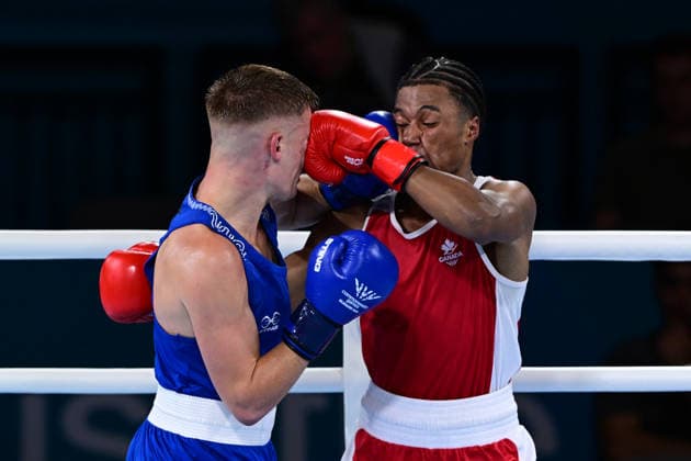 COM26 BOXING, Jacob Cassar (blue) of Australia in action during his Quarter Final match against Gabriel Labrie (red) of Canada during the Glasgow 2026 Commonwealth Games at SEC Centre in Glasgow, United Kingdom, Tuesday, July 28, 2026. ( NO ARCHIVING, EDITORIAL USE ONLY, AUSTRALIA ONLY Glasgow Scotland United Kingdom  Copyright: xDEANxLEWEINSx 20260728112959006490