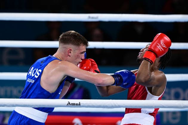 COM26 BOXING, Jacob Cassar (blue) of Australia in action during his Quarter Final match against Gabriel Labrie (red) of Canada during the Glasgow 2026 Commonwealth Games at SEC Centre in Glasgow, United Kingdom, Tuesday, July 28, 2026. ( NO ARCHIVING, EDITORIAL USE ONLY, AUSTRALIA ONLY Glasgow Scotland United Kingdom  Copyright: xDEANxLEWEINSx 20260728111200589674