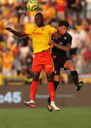 Como, Italy, 28th July 2026. Abdallah Sima of Racing Club de Lens challenges for an aerial ball with Charlie Walker-Smith of Crystal Palace FC during the Crystal Palace vs Racing Club de Lens Pre Season Friendly match at Stadio Giuseppe Sinigaglia, Como. Picture credit should read: Jonathan Moscrop Sportimage EDITORIAL USE ONLY. No use with unauthorised audio, video, data, fixture lists, club league logos or live services. Online in-match use limited to 120 images, no video emulation. No use in betting, games or single club league player publications. SPI_012_JM_PALACE_LENS SPI-4866-0010