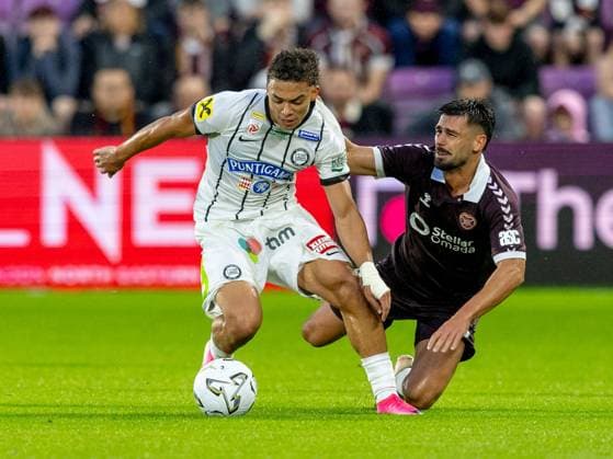 Jürgen Heil, of SK Sturm Graz and Claudio Braga of Heart of Midlothian compete for possession of the ball during the Hearts v Sturm Graz second leg of their Champions League second qualifying round at Tynecastle Stadium on Tuesday 28th July 2026 Heart of Midlothian v Sturm Graz, UEFA Champions League, 2nd Qualifying Round, 2nd Leg, Football, Tynecastle Park, Edinburgh, Scotland, UK - 28 Jul 2026Edinburgh Tynecastle Park Scotland United Kingdom  Copyright: xAlanxRennie Shutterstockx 17015998bg