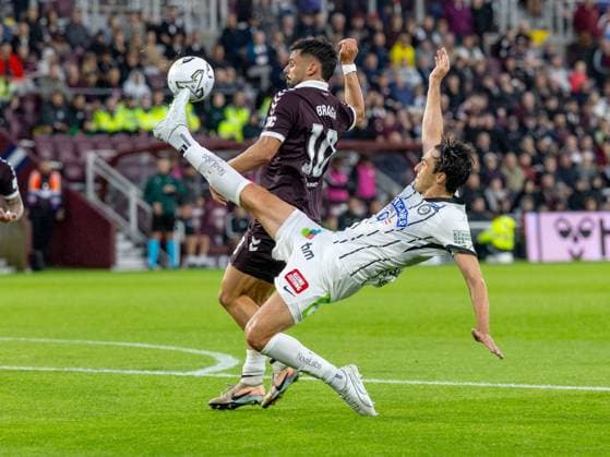 Albert Vallci, of SK Sturm Graz clears from Claudio Braga of Heart of Midlothian during the Hearts v Sturm Graz second leg of their Champions League second qualifying round at Tynecastle Stadium on Tuesday 28th July 2026 Heart of Midlothian v Sturm Graz, UEFA Champions League, 2nd Qualifying Round, 2nd Leg, Football, Tynecastle Park, Edinburgh, Scotland, UK - 28 Jul 2026Edinburgh Tynecastle Park Scotland United Kingdom  Copyright: xAlanxRennie Shutterstockx 17015998bj