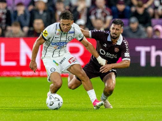 Jürgen Heil, of SK Sturm Graz and Claudio Braga of Heart of Midlothian compete for possession of the ball during the Hearts v Sturm Graz second leg of their Champions League second qualifying round at Tynecastle Stadium on Tuesday 28th July 2026 Heart of Midlothian v Sturm Graz, UEFA Champions League, 2nd Qualifying Round, 2nd Leg, Football, Tynecastle Park, Edinburgh, Scotland, UK - 28 Jul 2026Edinburgh Tynecastle Park Scotland United Kingdom  Copyright: xAlanxRennie Shutterstockx 17015998be