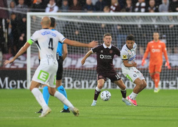 Heart of Midlothian v SK Sturm Graz UEFA Champions League Blair Spittal of Heart of Midlothian (middle) competes for the ball during the UEFA Champions League Second Qualifying Round Second Leg match at Tynecastle Park, Edinburgh 28 07 2026 UK Newspapers OUT Copyright: xFredxPalmerx FIL-23686-0044