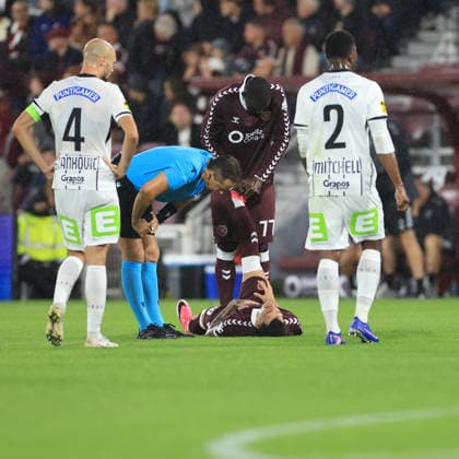 Heart of Midlothian v SK Sturm Graz UEFA Champions League Amadou Ba-Sy of Heart of Midlothian stretches the leg of Alexandros Kyziridis of Heart of Midlothian during the UEFA Champions League Second Qualifying Round Second Leg match at Tynecastle Park, Edinburgh 28 07 2026 UK Newspapers OUT Copyright: xFredxPalmerx FIL-23686-0091