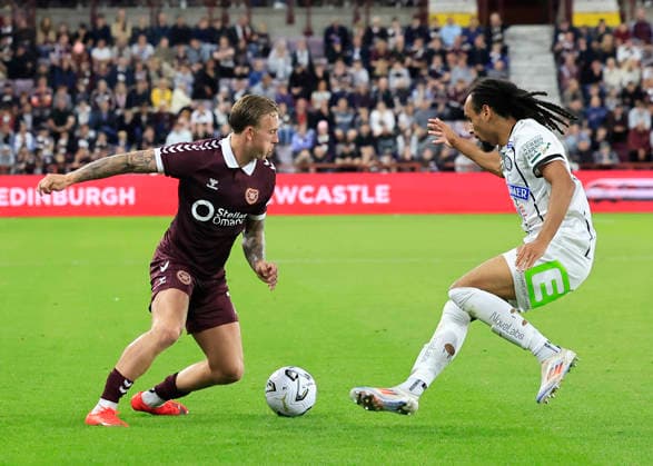 Heart of Midlothian v SK Sturm Graz UEFA Champions League Calvin Miller of Heart of Midlothian (left) and Emran Soglo of SK Sturm Graz in action during the UEFA Champions League Second Qualifying Round Second Leg match at Tynecastle Park, Edinburgh 28 07 2026 UK Newspapers OUT Copyright: xFredxPalmerx FIL-23686-0092