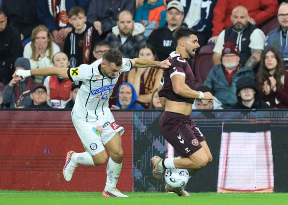 Heart of Midlothian v SK Sturm Graz UEFA Champions League Jürgen Heil of SK Sturm Graz competes for the ball with Cl‡udio Braga of Heart of Midlothian during the UEFA Champions League Second Qualifying Round Second Leg match at Tynecastle Park, Edinburgh 28 07 2026 UK Newspapers OUT Copyright: xFredxPalmerx FIL-23686-0093