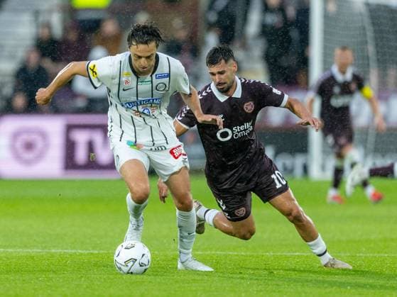 Albert Vallci, of SK Sturm Graz and Claudio Braga of Heart of Midlothian during the Hearts v Sturm Graz second leg of their Champions League second qualifying round at Tynecastle Stadium on Tuesday 28th July 2026 Heart of Midlothian v Sturm Graz, UEFA Champions League, 2nd Qualifying Round, 2nd Leg, Football, Tynecastle Park, Edinburgh, Scotland, UK - 28 Jul 2026Edinburgh Tynecastle Park Scotland United Kingdom  Copyright: xAlanxRennie Shutterstockx 17015998dk