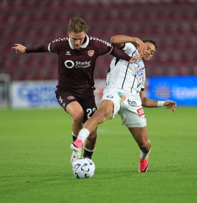 Heart of Midlothian v SK Sturm Graz UEFA Champions League Jordi Altena of Heart of Midlothian (left) shields the ball from Jacob Peter Hödl of SK Sturm Graz during the UEFA Champions League Second Qualifying Round Second Leg match at Tynecastle Park, Edinburgh 28 07 2026 UK Newspapers OUT Copyright: xFredxPalmerx FIL-23686-0104