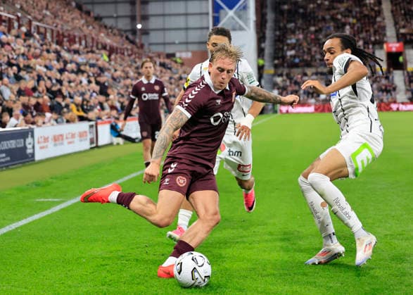 Heart of Midlothian v SK Sturm Graz UEFA Champions League Calvin Miller of Heart of Midlothian crosses the ball under pressure from Emran Soglo of SK Sturm Graz during the UEFA Champions League Second Qualifying Round Second Leg match at Tynecastle Park, Edinburgh 28 07 2026 UK Newspapers OUT Copyright: xFredxPalmerx FIL-23686-0105
