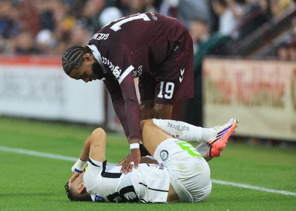 Heart of Midlothian v SK Sturm Graz UEFA Champions League Sabri Guendouz of Heart of Midlothian with the injured Jürgen Heil of SK Sturm Grazduring the UEFA Champions League Second Qualifying Round Second Leg match at Tynecastle Park, Edinburgh 28 07 2026 UK Newspapers OUT Copyright: xFredxPalmerx FIL-23686-0132
