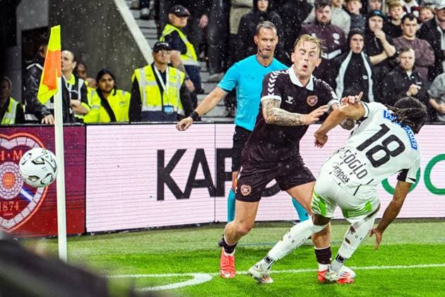 Heart of Midlothian v SK Sturm Graz UEFA Champions League Calvin Miller of Heart of Midlothian and Emran Soglo of SK Sturm Graz battle for the ball during the UEFA Champions League Second Qualifying Round Second Leg match at Tynecastle Park, Edinburgh 28 07 2026 UK Newspapers OUT Copyright: xJamiexJohnstonx FIL-23685-0078