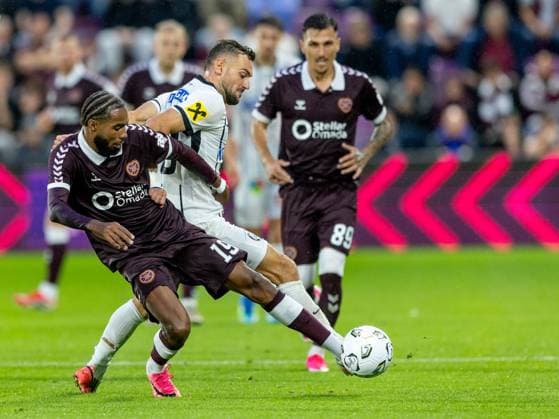 Sabri Guendouz of Heart of Midlothian and Jürgen Heil, of SK Sturm Graz compete for possession of the ball during the Hearts v Sturm Graz second leg of their Champions League second qualifying round at Tynecastle Stadium on Tuesday 28th July 2026 Heart of Midlothian v Sturm Graz, UEFA Champions League, 2nd Qualifying Round, 2nd Leg, Football, Tynecastle Park, Edinburgh, Scotland, UK - 28 Jul 2026Edinburgh Tynecastle Park Scotland United Kingdom  Copyright: xAlanxRennie Shutterstockx 17015998ev