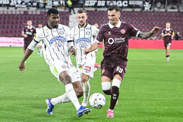 Heart of Midlothian v SK Sturm Graz UEFA Champions League Alexandros Kyziridis of Heart of Midlothian Jeyland Mitchell of SK Sturm Graz battle for the ball during the UEFA Champions League Second Qualifying Round Second Leg match at Tynecastle Park, Edinburgh 28 07 2026 UK Newspapers OUT Copyright: xJamiexJohnstonx FIL-23685-0136