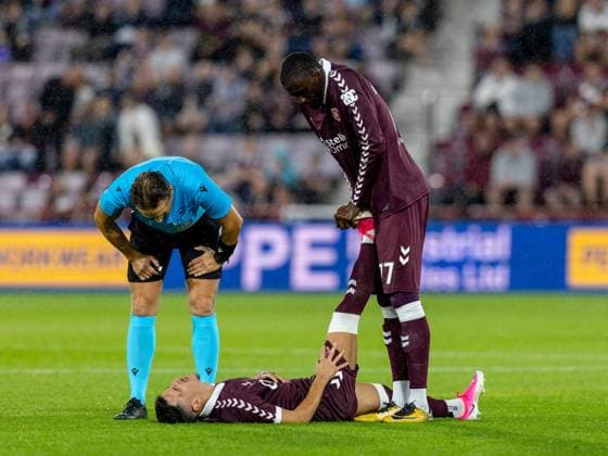 Amadou Ba-Sy of Heart of Midlothian helps Alexandros Kyziridis of Heart of Midlothian with cramp during the Hearts v Sturm Graz second leg of their Champions League second qualifying round at Tynecastle Stadium on Tuesday 28th July 2026 Heart of Midlothian v Sturm Graz, UEFA Champions League, 2nd Qualifying Round, 2nd Leg, Football, Tynecastle Park, Edinburgh, Scotland, UK - 28 Jul 2026Edinburgh Tynecastle Park Scotland United Kingdom  Copyright: xAlanxRennie Shutterstockx 17015998fp