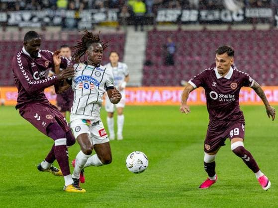 Amadou Ba-Sy of Heart of Midlothian and Emran Soglo, of SK Sturm Graz compete for possession of the ball during the Hearts v Sturm Graz second leg of their Champions League second qualifying round at Tynecastle Stadium on Tuesday 28th July 2026 Heart of Midlothian v Sturm Graz, UEFA Champions League, 2nd Qualifying Round, 2nd Leg, Football, Tynecastle Park, Edinburgh, Scotland, UK - 28 Jul 2026Edinburgh Tynecastle Park Scotland United Kingdom  Copyright: xAlanxRennie Shutterstockx 17015998fh