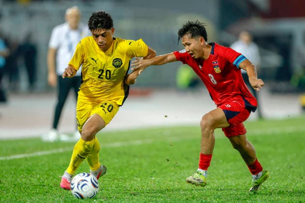 ASEAN Hyundai Cup 2026 Malaysia Vs Laos in Kuala Lumpur, Malaysia - 28 Jul 2026 Muhammad Syafiq Bin Ahmad of Malaysia (L) and Damoth Thongkhamsavath of Laosseen seen in action during the ASEAN Hyundai Cup 2026 match between Malaysia and Laos at Kuala Lumpur Football Stadium, Cheras. Final score; Malaysia 4:0 Laos. Kuala Lumpur Malaysia Copyright: xWongxFokxLoyx xSOPAxImagesx 20260728_AFW_1687 copy