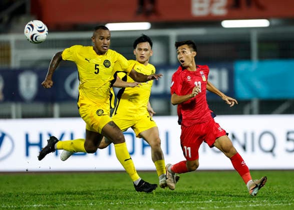 July 28, 2026, Kuala Lumpur, Malaysia: Rodney Celvin Akwensivie of Malaysia (L) and Chony Waenpaserth of Laos seen in action during the ASEAN Hyundai Cup 2026 match between Malaysia and Laos at Kuala Lumpur Football Stadium, Cheras. Final score; Malaysia 4:0 Laos. Kuala Lumpur Malaysia - ZUMAs197 20260728_aaa_s197_322 Copyright: xWongxFokxLoyx