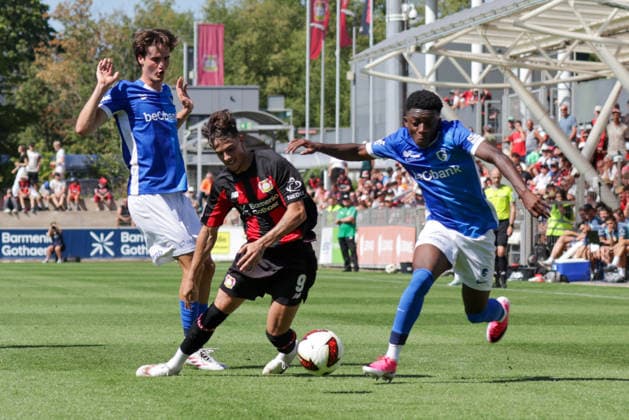 29.07.2026, xgrfx, Fussball Testspiel, Bayer 04 Leverkusen - KRC Genk v.l. Nikolas Sattelberger (KRC Genk), Afonso Moreira (Bayer Leverkusen), Emmanuel Sarfo (KRC Genk) (DFL DFB REGULATIONS PROHIBIT ANY USE OF PHOTOGRAPHS as IMAGE SEQUENCES and or QUASI-VIDEO) Leverkusen *** July 29, 2026, xgrfx, Soccer Friendly Match, Bayer 04 Leverkusen vs. KRC Genk, Nikolas Sattelberger (KRC Genk), Afonso Moreira (Bayer Leverkusen), Emmanuel Sarfo, KRC Genk. DFL and DFB regulations prohibit any use of photographs as image sequences and or quasi-video. Leverkusen