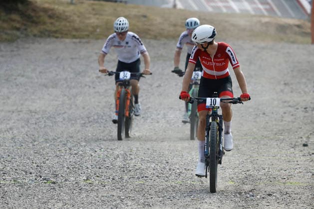 29.07.2026, Monteceneri, Monteceneri, 2026 UEC MTB European Championship, EM, Europameisterschaft XCC Qualifications Men Junior, , Head 1, Michael Ortner 10 (AUT) arriving in second position, followed by Julius Klose 34 (GER) and Quirin Bach 29 (GER) Monteceneri Monteceneri Ticino Switzerland *** July 29, 2026, Monteceneri, Monteceneri, 2026 UEC MTB European Championship XCC Qualifications Men Junior, , Head 1, Michael Ortner 10 AUT finishing in second place, followed by Julius Klose 34 GER and Quirin Bach 29 GER Monteceneri Monteceneri Ticino Switzerland Copyright: xJustPictures.ch FrancescoxMinghettix jp-en-FrMi-_NG_0591