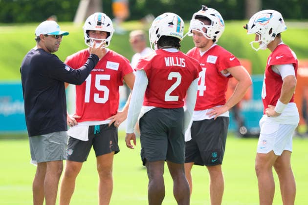 MIAMI GARDENS, FL - JULY 29: Miami Dolphins quarterbacks coach Bush Hamdan speaks with quarterback s Cam Miller (15), Malik Willis (2), Quinn Ewers (14) and Mark Gronowski (16) during the Miami Dolphins Training Camp on August 29, 2026, at the Baptist Health Training Complex in Miami Gardens, FL. (Photo by Doug Murray Icon Sportswire) NFL, American Football Herren, USA JUL 29 Dolphins Training Camp EDITORIAL USE ONLY Icon796260729039