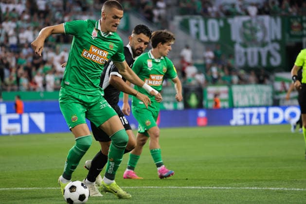 SOCCER - UEFA ECL, Rapid vs Coloma VIENNA,AUSTRIA,29.JUL.26 - SOCCER - UEFA Conference League, qualification, SK Rapid Wien vs FC Santa Coloma. Image shows Nenad Cvetkovic (Rapid) and Adria Arjona (Coloma).  GEPAxpictures xDavidxBitzan