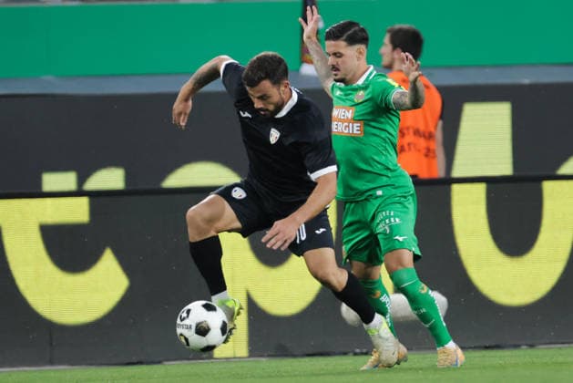 SOCCER - UEFA ECL, Rapid vs Coloma VIENNA,AUSTRIA,29.JUL.26 - SOCCER - UEFA Conference League, qualification, SK Rapid Wien vs FC Santa Coloma. Image shows Guillaume Lopez (Coloma) and Marco Tilio (Rapid).  GEPAxpictures xDavidxBitzan