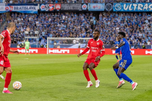 Amirani Dzagania of Iberia 1999 Tbilisi and Alasana Yirajang of SK Slovan Bratislava seen during UEFA Champions league second qualifying round game between teams of SK Slovan Bratislava and Iberia 1999 Tbilisi (Dominika Kortvelyesiova Ball Raw Images) Bratislava Tehelne Pole stadium Slovakia Copyright: xDominikaxKortvelyesiovax DKOR8561