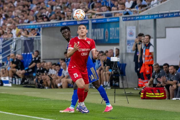Aleksandre Amisulashvili of Iberia 1999 Tbilisi and Alasana Yirajang of SK Slovan Bratislava seen during UEFA Champions league second qualifying round game between teams of SK Slovan Bratislava and Iberia 1999 Tbilisi (Dominika Kortvelyesiova Ball Raw Images) Bratislava Tehelne Pole stadium Slovakia Copyright: xDominikaxKortvelyesiovax DKOR8571