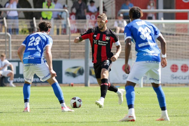 29.07.2026, xgrfx, Fussball Testspiel, Bayer 04 Leverkusen - KRC Genk v.l. Robin Mirisola (KRC Genk), Robert Andrich (Bayer Leverkusen), Noah Adedeji-Sternberg (KRC Genk) (DFL DFB REGULATIONS PROHIBIT ANY USE OF PHOTOGRAPHS as IMAGE SEQUENCES and or QUASI-VIDEO) Leverkusen *** July 29, 2026, xgrfx, Soccer Friendly Match, Bayer 04 Leverkusen vs. KRC Genk, Robin Mirisola (KRC Genk), Robert Andrich (Bayer Leverkusen), Noah Adedeji Sternberg, KRC Genk. DFL and DFB regulations prohibit any use of photographs as image sequences and or quasi-video. Leverkusen