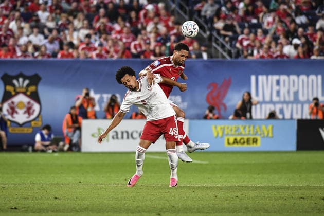 Calum Scanlon (Liverpool FC) and Zak Vyner (Wrexham AFC) go up for the ball during the pre-season friendly match between Liverpool FC and Wrexham AFC at Yankee Stadium on July 29, 2026 in Bronx, NY, United States.  Copyright: xRebekahxWynkoopx xSPPx Sportspressphoto_SPR198393