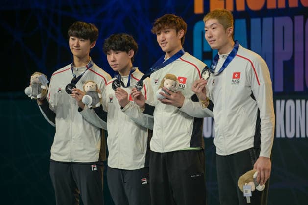 HONG KONG, CHINA - JULY 28: Fencers of Team Hong Kong China pose for a photo on the podium after losing to Team Italy in the Men s Foil Team Final at the Fencing World Championships 2026 at AsiaWorld-Expo on July 28, 2026 in Hong Kong, China. Team Hong Kong China finished as runners-up with a score of 44-45.  Copyright: xChinaxNewsxServicex 111657209133
