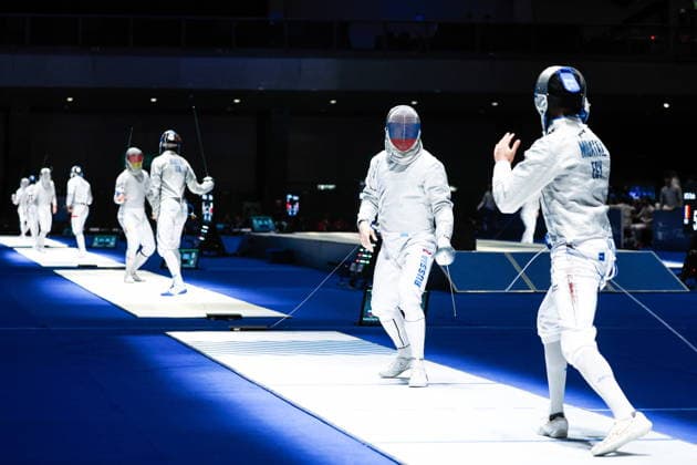 CHINA, HONG KONG - JULY 30, 2026: Athletes Dmitry Nasonov of Russia and Adham Moataz (L-R front) of Egypt fight in their team sabre bout during the 2026 Kerry Fencing World Championships. Mikhail Sinitsyn TASS  95619067