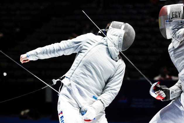CHINA, HONG KONG - JULY 30, 2026: Athletes Dmitry Nasonov (L) of Russia and Adham Moataz of Egypt fight in their team sabre bout during the 2026 Kerry Fencing World Championships. Mikhail Sinitsyn TASS  95619070