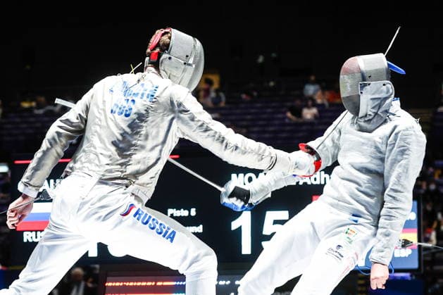 CHINA, HONG KONG - JULY 30, 2026: Athletes Dmitry Nasonov (L) of Russia and Adham Moataz of Egypt fight in their team sabre bout during the 2026 Kerry Fencing World Championships. Mikhail Sinitsyn TASS  95619590