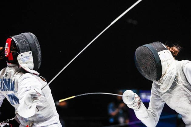 CHINA, HONG KONG - JULY 30, 2026: Athletes Vladislava Peniushkina (R) of Russia and Sera Azuma of Japan fight in their team foil bout during the 2026 Kerry Fencing World Championships. Mikhail Sinitsyn TASS  95619633
