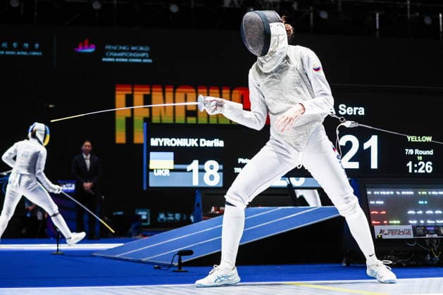 CHINA, HONG KONG - JULY 30, 2026: Athlete Vladislava Peniushkina of Russia fights in her team foil bout against Sera Azuma of Japan during the 2026 Kerry Fencing World Championships. Mikhail Sinitsyn TASS  95619635