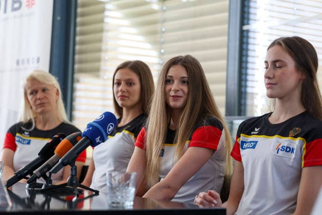 Frankfurt am Main, July 30, 2026: Isabell Sawade (RSG-Teamchefin und TK-Mitglied Weltturnverband), Anastasia Simakova (TSV Schmiden), Lada Pusch (TSV Schmiden), Darja Varfolomeev (TSV Schmiden) during a media day from Deutscher Turner-Bund (DTB) ahead of the Rhythmic gymnastics, Rhythmische Sportgymnastik, RSG World Championships at Festhalle Frankfurt (Aug. 12 16.2026) *** Frankfurt am Main, July 30, 2026 Isabell Sawade, RSG Team Manager and Technical Committee Member of the International Gymnastics Federation (DTB), Anastasia Simakova, TSV Schmiden; Lada Pusch, TSV Schmiden; Darja Varfolomeev, TSV Schmiden, during a media day hosted by the German Gymnastics Federation (DTB) ahead of the Rhythmic Gymnastics World Championships at the Festhalle Frankfurt, August 12–16, 2026 Copyright: HMBxMedia JoaquimxFerreira