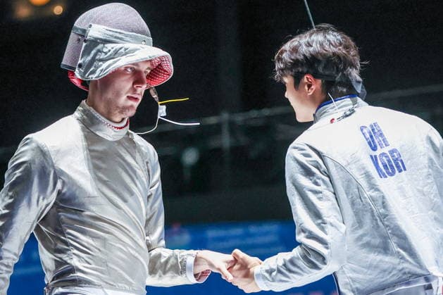CHINA, HONG KONG - JULY 30, 2026: Athletes Pavel Graudyn (L) of Russia and Sang-uk Oh of South Korea shake hands in their team sabre bout during the 2026 Kerry Fencing World Championships. Mikhail Sinitsyn TASS  95620459