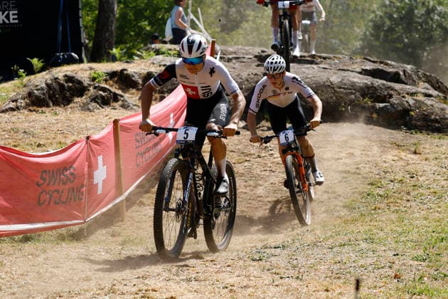 30.07.2026, Monteceneri, Monte Ceneri, 2026 UEC MTB European Championship, EM, Europameisterschaft XCC Men Junior s Final (cross country short track), Marwan Barhoumi 5 (SUI) and Julius Klose 6 (GER) Monteceneri Monte Ceneri Ticino Switzerland *** July 30, 2026, Monteceneri, Monte Ceneri, 2026 UEC MTB European Championship XCC Men s Junior Final—Cross Country Short Track, Marwan Barhoumi (5, SUI) and Julius Klose (6, GER), Monteceneri, Monte Ceneri, Ticino, Switzerland Copyright: xJustPictures.ch FrancescoxMinghettix jp-en-FrMi-_NG_0758